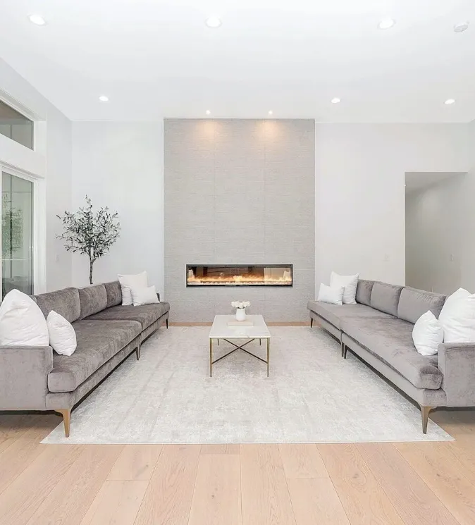 Luxury custom home living room with fireplace — built by Dornford Building Group in Adelaide